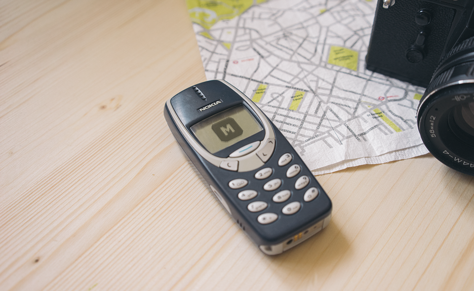 Nokia 3310 on a Wooden Desk Free Mockup