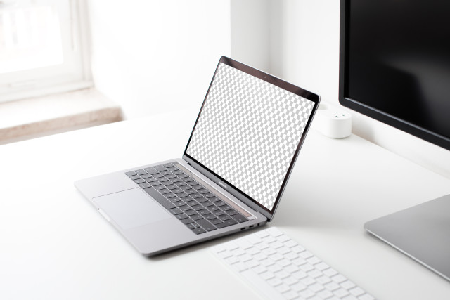 Macbook Pro on the Table Free Mockup