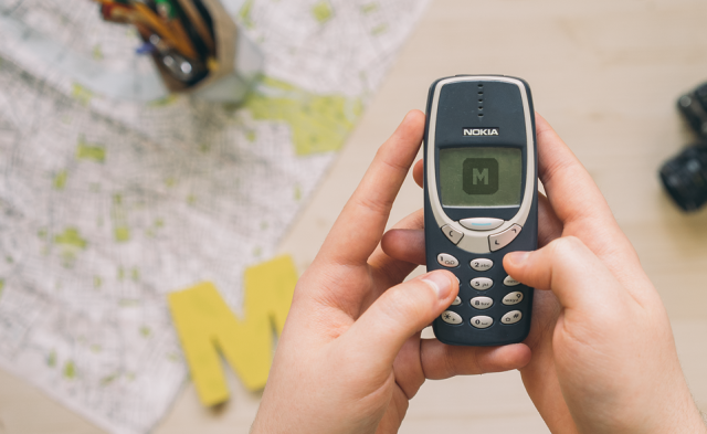 Playing on Nokia 3310 Free Mockup