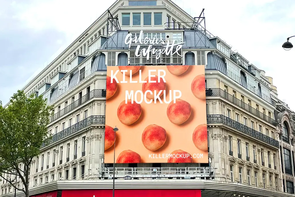 Large billboard mockup on the facade of a historic Parisian department store