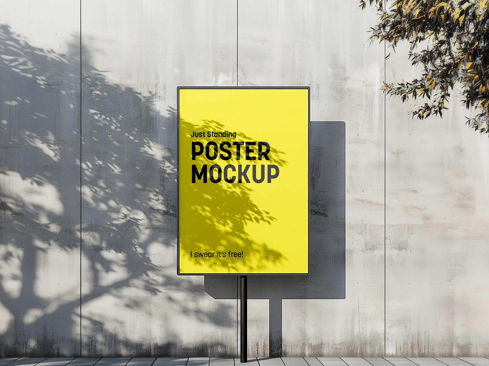 Free-standing poster mockup in urban setting with concrete wall, highlighting sleek design and natural light for designers.