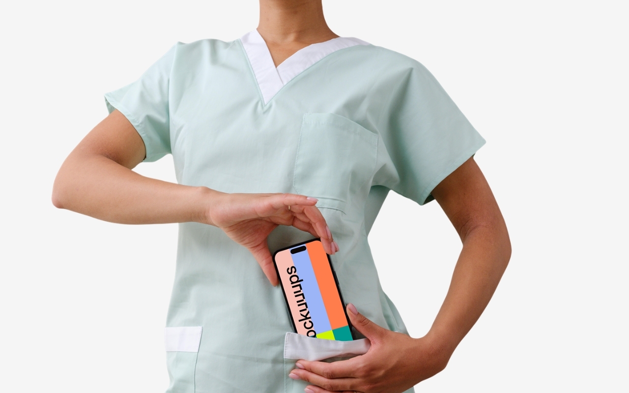 iPhone mockup held in female doctor's hand with transparent background - professional device mockup template