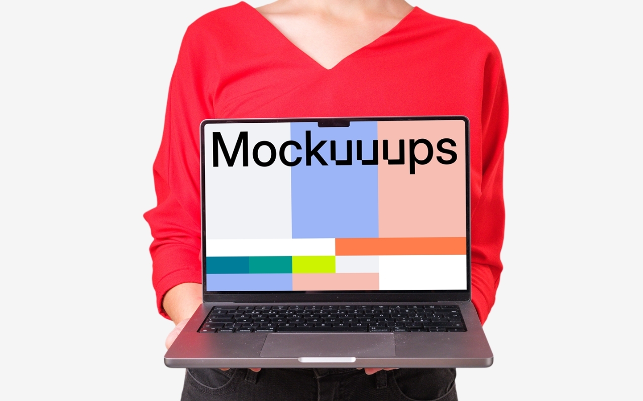 Woman in red shirt holding MacBook Pro mockup with transparent background for showcasing digital products and websites