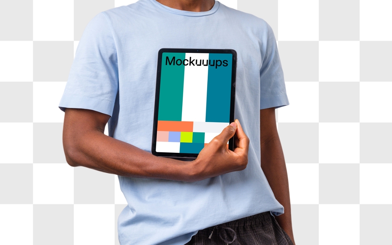 African-American man in light blue t-shirt holding iPad Air mockup with transparent background for design customization