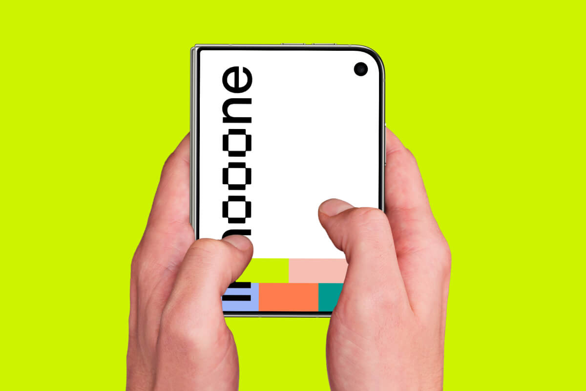 Two-handed hold on a closed iPhone Duo against lime green