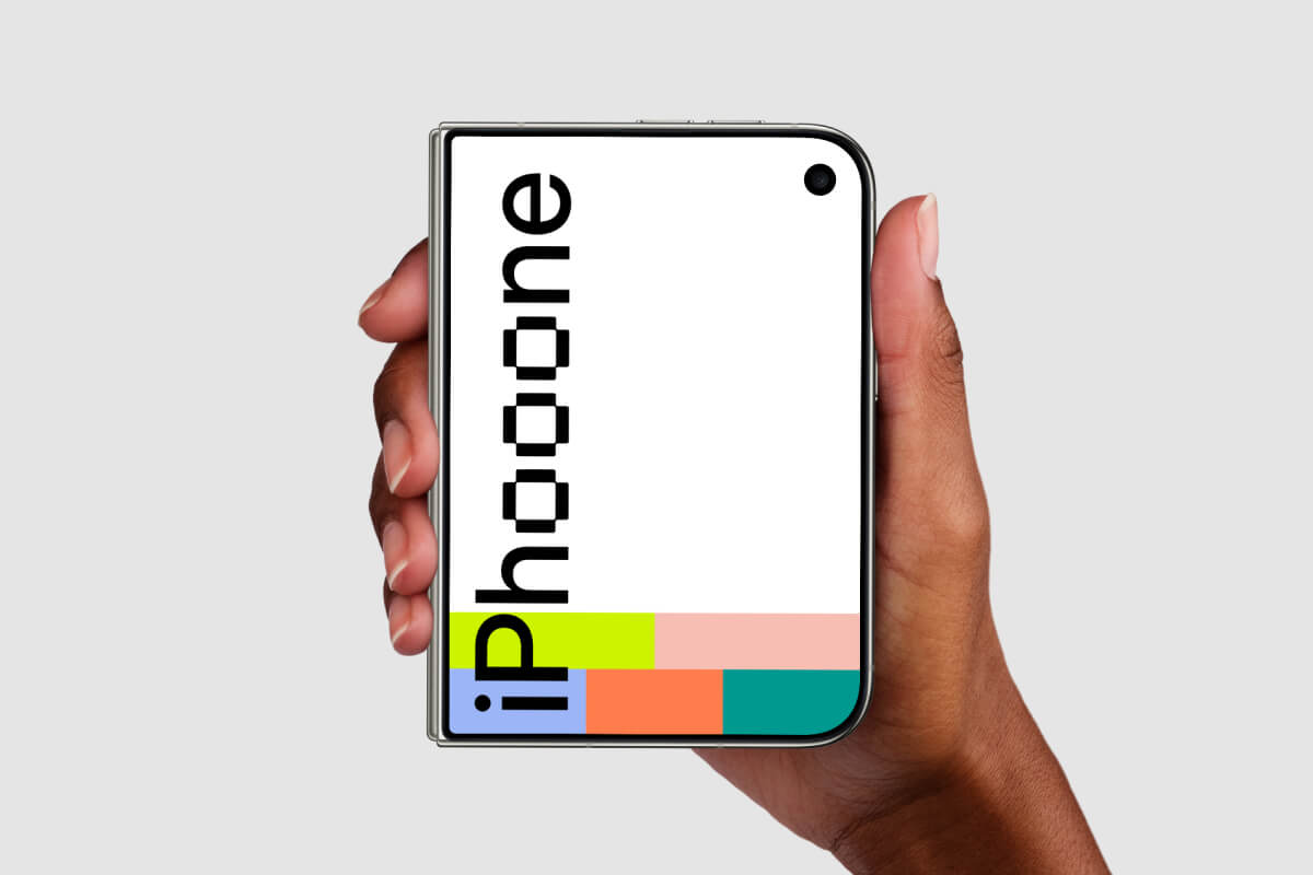 Closed iPhone Duo held from both sides on a light gray backdrop