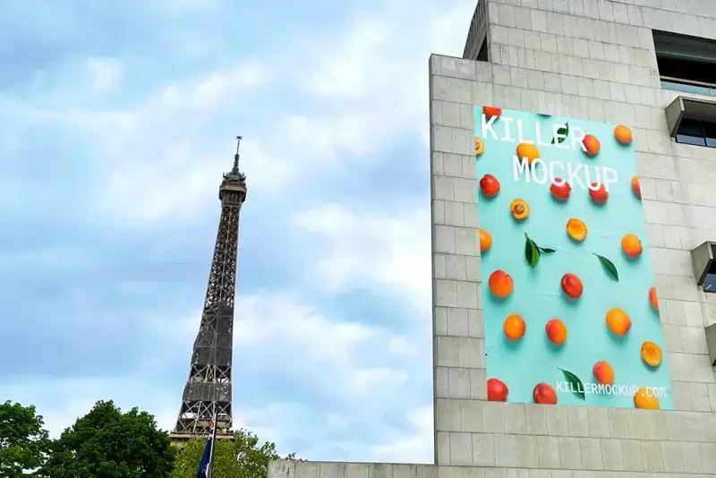 Billboard mockup on a modern building near the Eiffel Tower in Paris