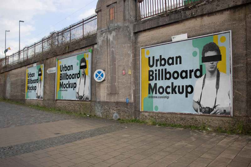 Three billboard mockups on a rugged urban wall