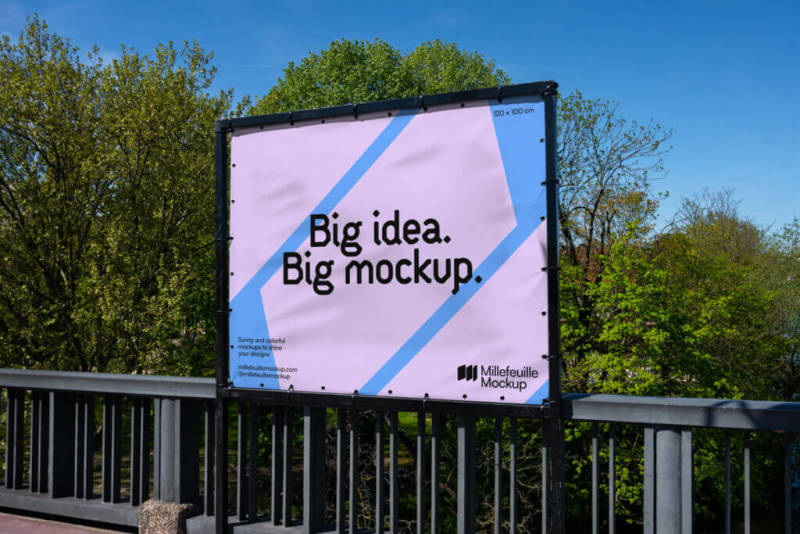 Outdoor billboard mockup with a backdrop of trees and greenery