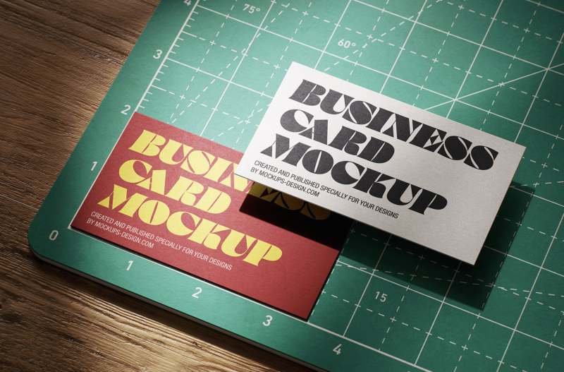 Business card mockup on a cutting mat, ideal for showcasing the best EU business card designs with realistic shadows.